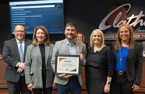 Taylor Bussinger recognized by the board